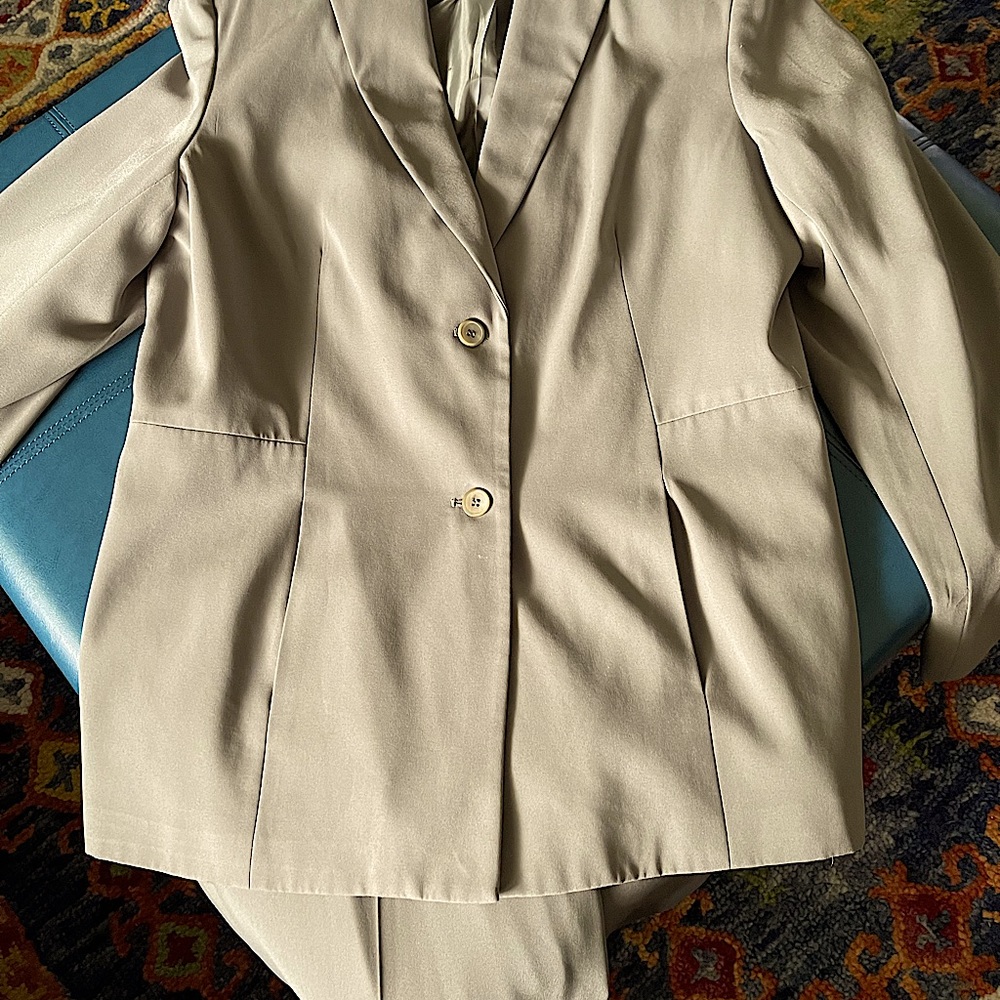 Ladies two piece suit olive green. The jacket is a size 14, pants are a size 12.